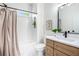 Well-lit bathroom featuring a shower-tub, a vanity, and modern fixtures at 905 Gaston Sw St, Atlanta, GA 30310