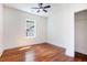 Bedroom with hardwood floors, a large window, and a closet with shelving at 905 Gaston Sw St, Atlanta, GA 30310