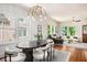 Open concept dining room with large windows connects to the living room creating an ideal space for entertaining at 905 Gaston Sw St, Atlanta, GA 30310