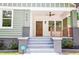 Inviting front porch with wood railing detail on a beautifully renovated craftsman-style home at 905 Gaston Sw St, Atlanta, GA 30310