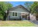 Charming craftsman-style home featuring a large front porch, green siding, and a well-maintained front yard at 905 Gaston Sw St, Atlanta, GA 30310
