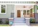 A welcoming covered front porch and well-kept landscaping enhance the curb appeal of this beautiful home at 905 Gaston Sw St, Atlanta, GA 30310