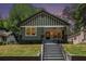 Lovely home with a covered front porch and manicured front lawn, creating a warm welcome at 905 Gaston Sw St, Atlanta, GA 30310