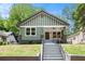 Charming craftsman home with a inviting front porch and stylish green and white exterior at 905 Gaston Sw St, Atlanta, GA 30310