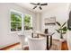 Bright home office features hardwood floors, neutral paint and large windows overlooking the landscaped backyard at 905 Gaston Sw St, Atlanta, GA 30310