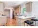 Modern kitchen with stainless steel appliances, quartz countertops, and a breakfast bar for casual dining at 905 Gaston Sw St, Atlanta, GA 30310