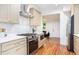 Modern kitchen featuring stainless steel appliances, marble backsplash, and ample cabinetry for storage at 905 Gaston Sw St, Atlanta, GA 30310
