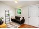 Cozy living room with black sofa, geometric rug, and natural light from the window at 905 Gaston Sw St, Atlanta, GA 30310