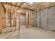 Unfinished basement area with exposed wooden frame and concrete wall at 26 Trillium Ln, Acworth, GA 30101