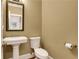 Bathroom featuring pedestal sink, toilet, and neutral wall color at 26 Trillium Ln, Acworth, GA 30101