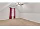 Neutral-toned bedroom with plush carpeting and a ceiling fan at 26 Trillium Ln, Acworth, GA 30101