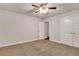 Neutral bedroom featuring carpet floors, a ceiling fan and standard white closet doors at 26 Trillium Ln, Acworth, GA 30101
