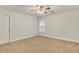 Spacious bedroom with neutral carpeting and a ceiling fan at 26 Trillium Ln, Acworth, GA 30101