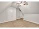 Cozy bedroom featuring a ceiling fan and double-door closet at 26 Trillium Ln, Acworth, GA 30101