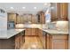 Gourmet kitchen features granite countertops, stainless steel appliances, and a central island at 26 Trillium Ln, Acworth, GA 30101