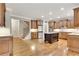 Spacious kitchen featuring hardwood floors, stainless steel appliances, and a center island at 26 Trillium Ln, Acworth, GA 30101