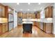 Spacious kitchen with an island, stainless steel appliances, and hardwood floors at 26 Trillium Ln, Acworth, GA 30101
