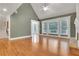 Inviting living room featuring a fireplace, hardwood floors, and bright natural light from large windows at 26 Trillium Ln, Acworth, GA 30101