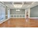 Elegant living room with hardwood floors, coffered ceilings, and multiple windows for natural light at 26 Trillium Ln, Acworth, GA 30101