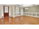 Spacious living room with hardwood floors, coffered ceilings, and ample natural light at 26 Trillium Ln, Acworth, GA 30101