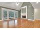 Bright living room features hardwood floors, fireplace with white mantle and large windows at 26 Trillium Ln, Acworth, GA 30101