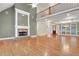 Bright living room boasts a fireplace, gleaming hardwood floors, and vaulted ceiling at 26 Trillium Ln, Acworth, GA 30101