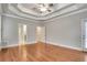 Main bedroom with hardwood floors, tray ceiling, and closet at 26 Trillium Ln, Acworth, GA 30101
