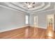 Main bedroom with hardwood floors, tray ceiling, and en-suite bathroom at 26 Trillium Ln, Acworth, GA 30101