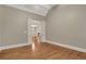A spacious room featuring hardwood floors, decorative columns, and architectural details at 26 Trillium Ln, Acworth, GA 30101