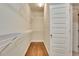 Spacious walk-in closet with ample shelving and hardwood floors at 26 Trillium Ln, Acworth, GA 30101