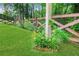 Beautifully landscaped yard with wooden fence and vibrant flower bed at 26 Trillium Ln, Acworth, GA 30101