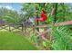 Well-manicured lawn with wooden fence and lush flower bed, perfect for relaxing at 26 Trillium Ln, Acworth, GA 30101