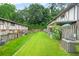Backyard with green grass, fence, and plants for gardening at 2952 N Dekalb Dr # C, Atlanta, GA 30340