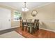 Cozy dining area with a wooden table, seating for four, and view of the front yard at 2952 N Dekalb Dr # C, Atlanta, GA 30340