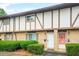Traditional townhome featuring a brick facade and well-maintained landscaping with trimmed hedges at 2952 N Dekalb Dr # C, Atlanta, GA 30340
