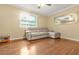Cozy living room with wood floors, a comfortable leather sofa, and plenty of natural light at 2952 N Dekalb Dr # C, Atlanta, GA 30340