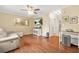 Bright living room with hardwood floors, a ceiling fan, and a comfortable leather couch at 2952 N Dekalb Dr # C, Atlanta, GA 30340
