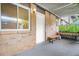 Back patio with gardening bench and bright light, door leading to the interior at 2952 N Dekalb Dr # C, Atlanta, GA 30340