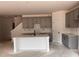 Charming new kitchen features gray cabinets, a kitchen island, and marble countertops at 3106 Marbella Cir # 3, Kennesaw, GA 30152