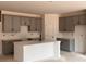 Charming new kitchen features gray cabinets, a kitchen island, and marble countertops at 3106 Marbella Cir # 3, Kennesaw, GA 30152