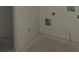 Laundry room with utility connections, white walls, and light-colored flooring at 3106 Marbella Cir # 3, Kennesaw, GA 30152