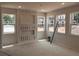 Bright living room featuring a custom entertainment center and natural light from large windows at 3106 Marbella Cir # 3, Kennesaw, GA 30152