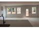 Unfinished new living room features a wall of windows letting in lots of natural light at 3106 Marbella Cir # 3, Kennesaw, GA 30152
