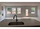 Unfinished new living room features a wall of windows letting in lots of natural light at 3106 Marbella Cir # 3, Kennesaw, GA 30152