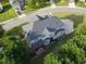 Aerial view showcasing the home's roof, deck, landscaping, and surrounding greenery at 3898 Heritage Oaks Dr, Powder Springs, GA 30127