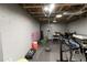 Unfinished basement with work out and fitness equipment at 3898 Heritage Oaks Dr, Powder Springs, GA 30127