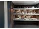 Finished basement features built-in shelving and displays of memorabilia at 3898 Heritage Oaks Dr, Powder Springs, GA 30127