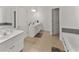 Bright bathroom with double sinks and separate bathtub at 3898 Heritage Oaks Dr, Powder Springs, GA 30127
