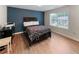 Bedroom featuring a large window and hardwood flooring at 3898 Heritage Oaks Dr, Powder Springs, GA 30127