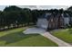 Home featuring a lush lawn, driveway, and a two-car garage at 3898 Heritage Oaks Dr, Powder Springs, GA 30127